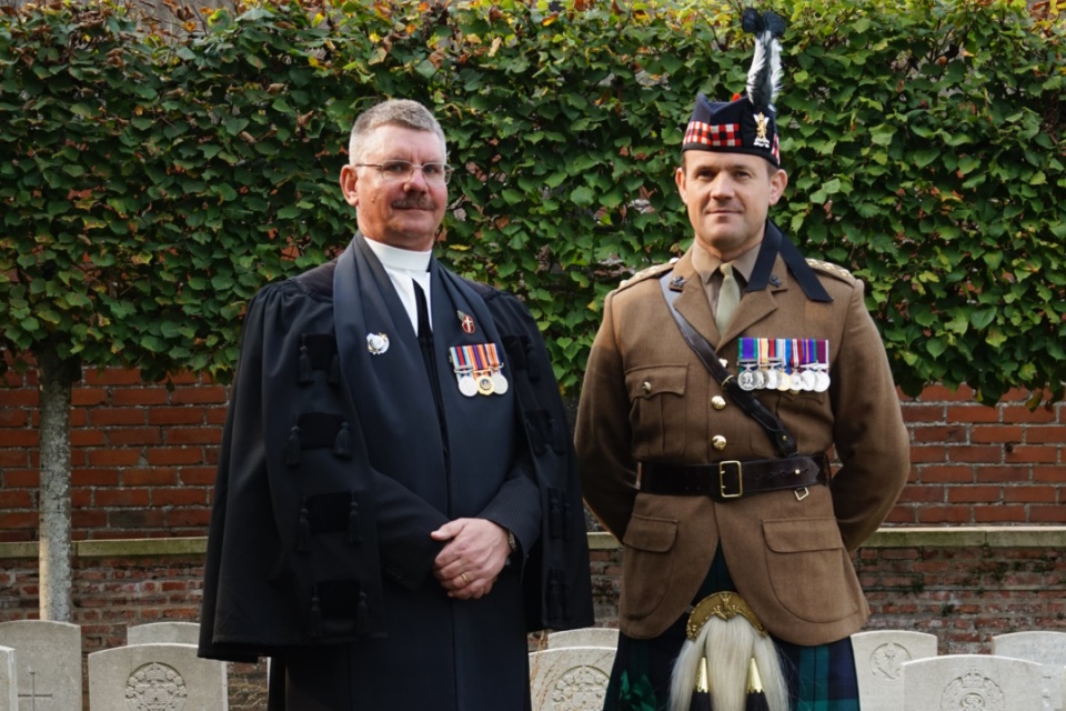 Reverend Paul van Sittert CF and Captain Gary Main both 4 Scots Regiment at the graveside of Private Anderson. Crown Copyright. All Rights Reserved.