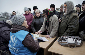 UNHCR staff distribute aid to people affected by conflict in Ukraine, March 2015. Picture: Andrew McConnell/Panos