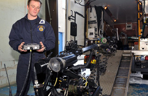 A Royal Navy bomb disposal expert operates the remotely-controlled Mark 8 Wheelbarrow robot