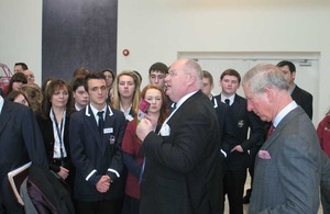 Eric Pickles and the Prince of Wales with a group of young people.