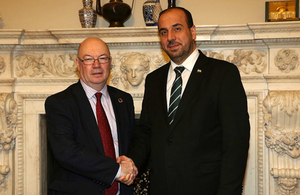 Minister Alistair Burt shaking hands with Nasser Hariri from the Syrian Negotiation Commission