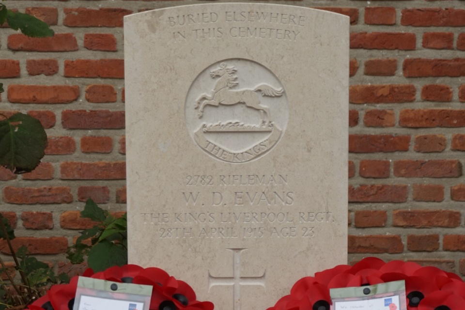Newly placed gravestone bearing the name of Rifleman Evans. Crown Copyright. All Rights Reserved.