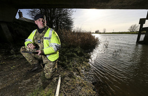 Corporal Paul 'Barney' Barnard from RAF Marham conducts flood defence surveys around the town of Earith on behalf of the Environment Agency.