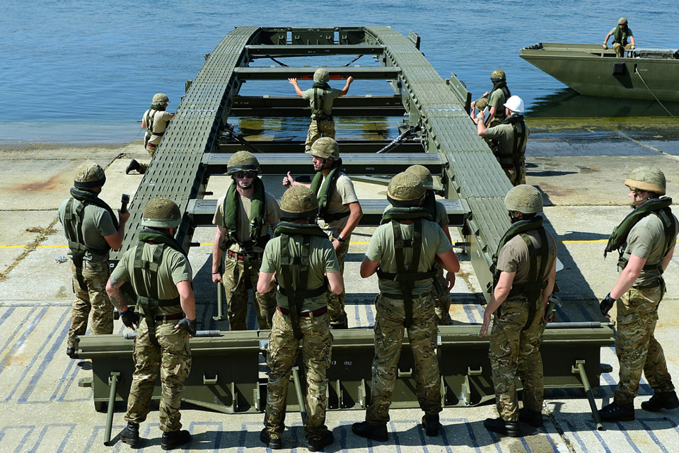 British Army sappers prepare to set up an Air Portable Ferry Bridge