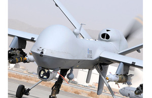 RAF Reaper Remotely Piloted Air System taxis along the runway at Kandahar Air Field, Afghanistan