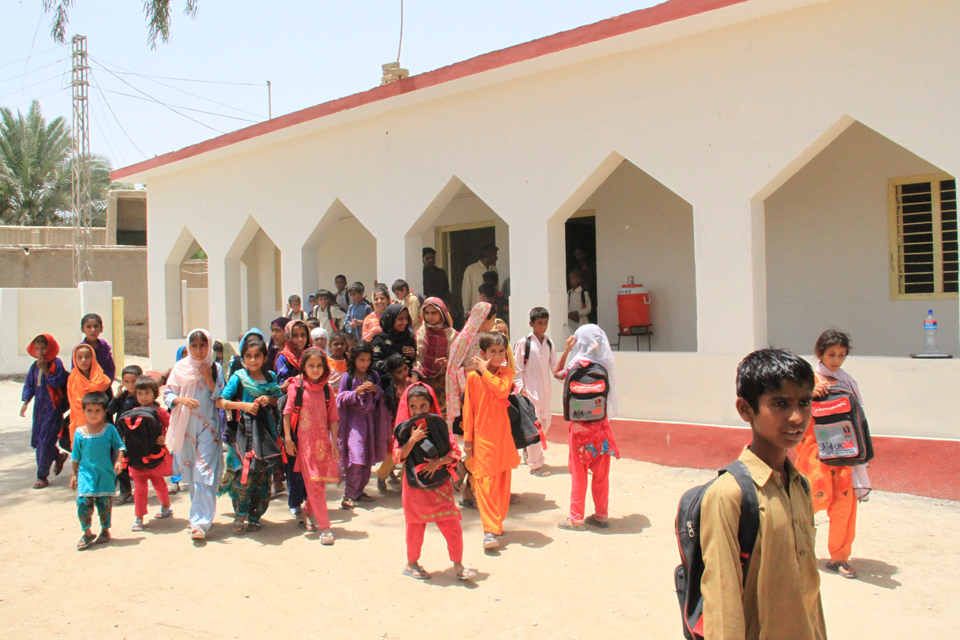 Sound structure: Daddla's fellow pupils outside the refurbished school. Picture: Vicki Francis/DFID