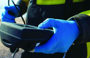 One of our staff checking a water sample on site