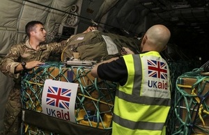 Aid supplies for northern Iraq being checked on board aircraft.