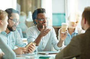 A group of men and women having a roundtable discussion