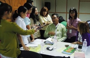 Participants interviewing an official from Environmental Conservation Ministry