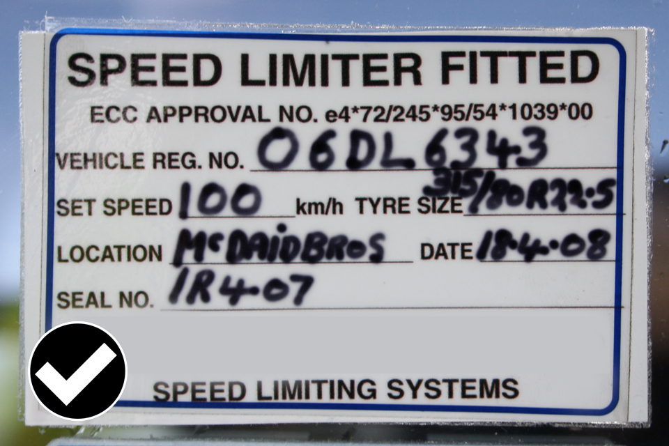 Allowed: the speed limiter plaque fitted to a window must be facing outwards and at the correct height.
