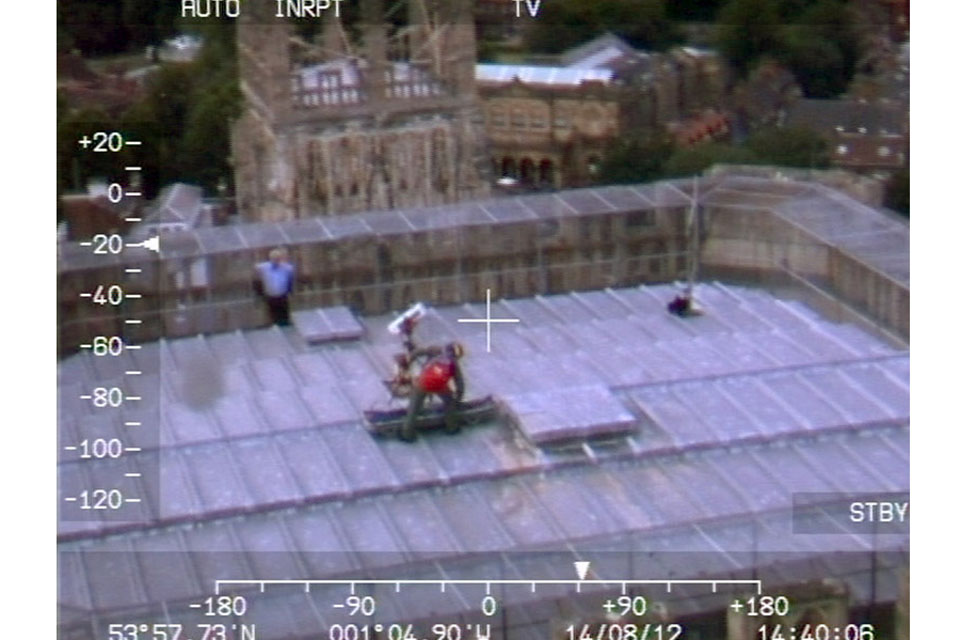 The view from the cockpit of a Leconfield Sea King Search and Rescue helicopter as a crewman simulates a casualty evacuation from the top of York Minster 