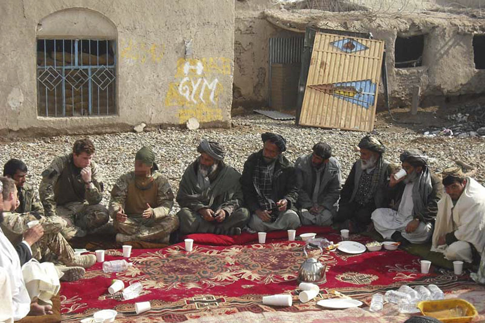 UK soldiers help Afghan government officials meet village elders