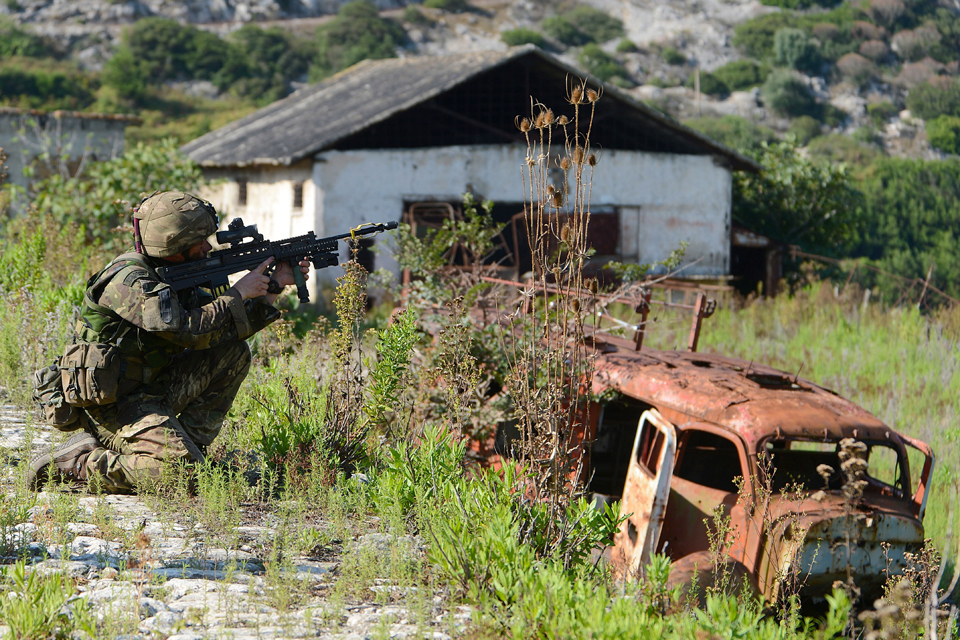 A Royal Marine looks out for the enemy 