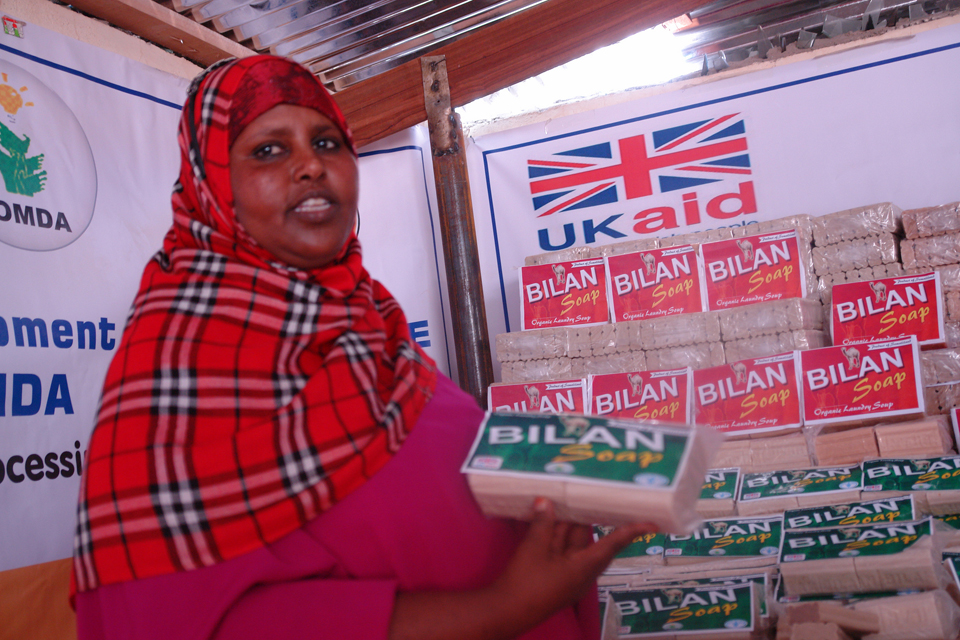 Swizzer Mohamed holds a finished pack of soap. Picture: FAO