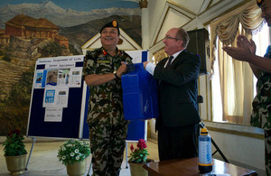 Ambassador Sparkes presents Brigadier General Basnyat with one of the Lifesaver jerry cans