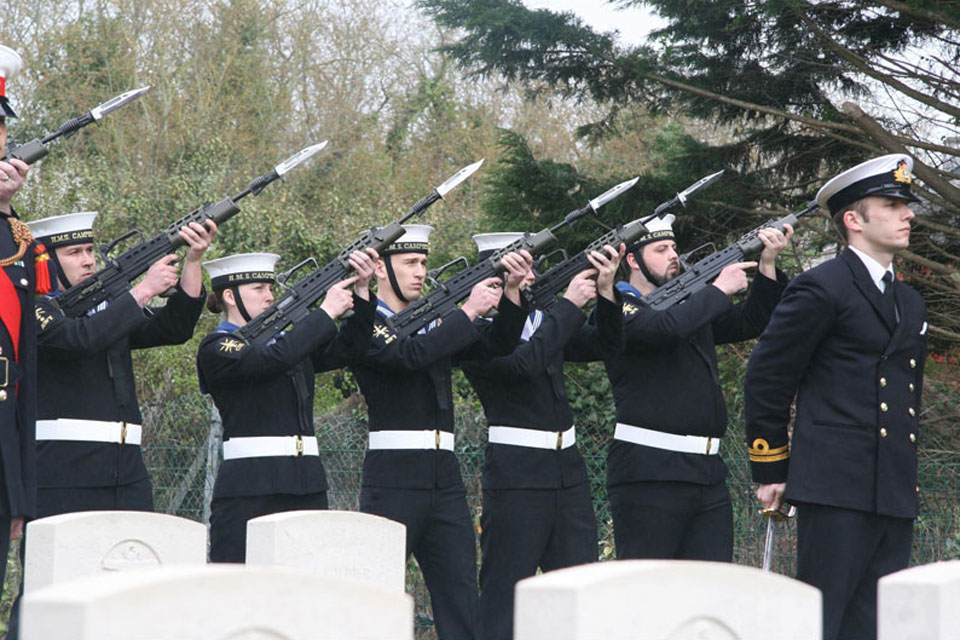 Members of HMS Campbeltown's ship's company conduct seven-gun salute at the cemetery in St Nazaire in remembrance of the fallen