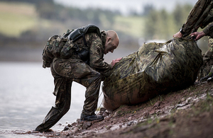 A soldier completes the infamous River Crossing station on Exercise Cambrian patrol