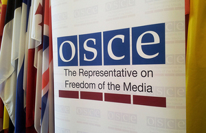 OSCE banner and flags