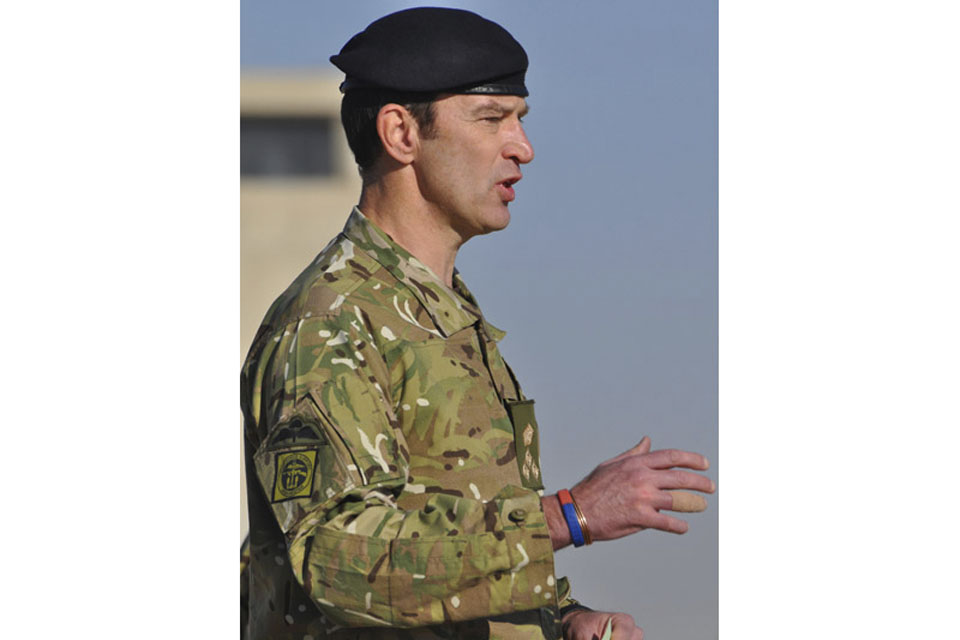 Brigadier 'Mitch' Mitchell addresses the Tongan contingent during the ceremonial handover in Camp Bastion, Afghanistan  