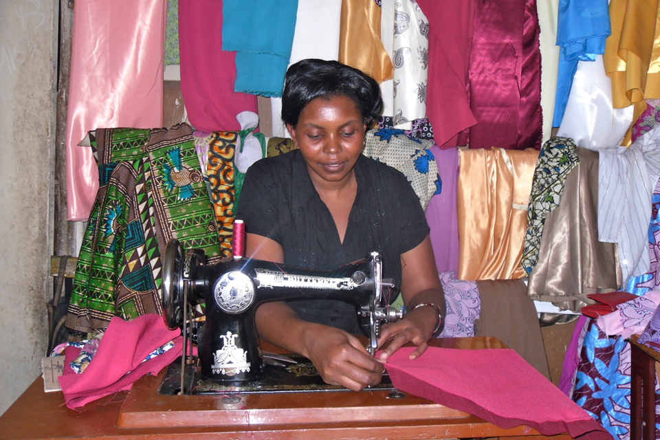 Vick Makundi, at work in her tailor shop. Picture: AFCAP/Crown Agents