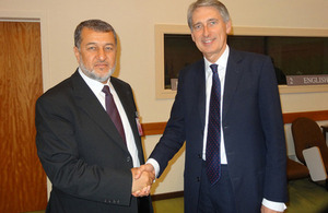Afghan Defence Minister Bismillah Mohammadi (left) shakes hands with UK Defence Secretary Philip Hammond [Picture: Crown copyright]