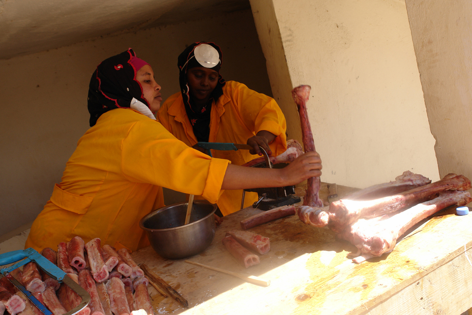 Workers at the Somaliland Meat Development Association soap making plant cut bones in preparation for soap making. Picture: FAO 