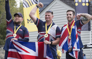 RAF veteran Matthew Neve, British Army Sgt Gareth Paterson and British Army veteran Kieran Wood celebrate winning gold in the Team Open Recurve Final at Archery.