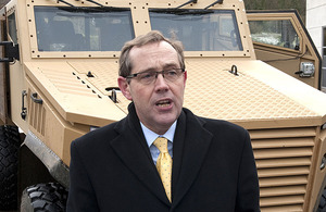 Peter Luff with a Foxhound armoured vehicle (stock image)