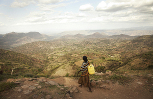 An Ethiopian woman walks home having collected clean water. Picture: WaterAid / Anna Kari