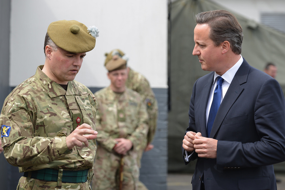Prime Minister David Cameron talking to a member of 6th Battalion The Royal Regiment of Scotland