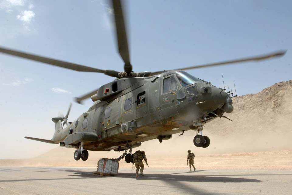 An RAF Merlin helicopter takes off with an underslung load