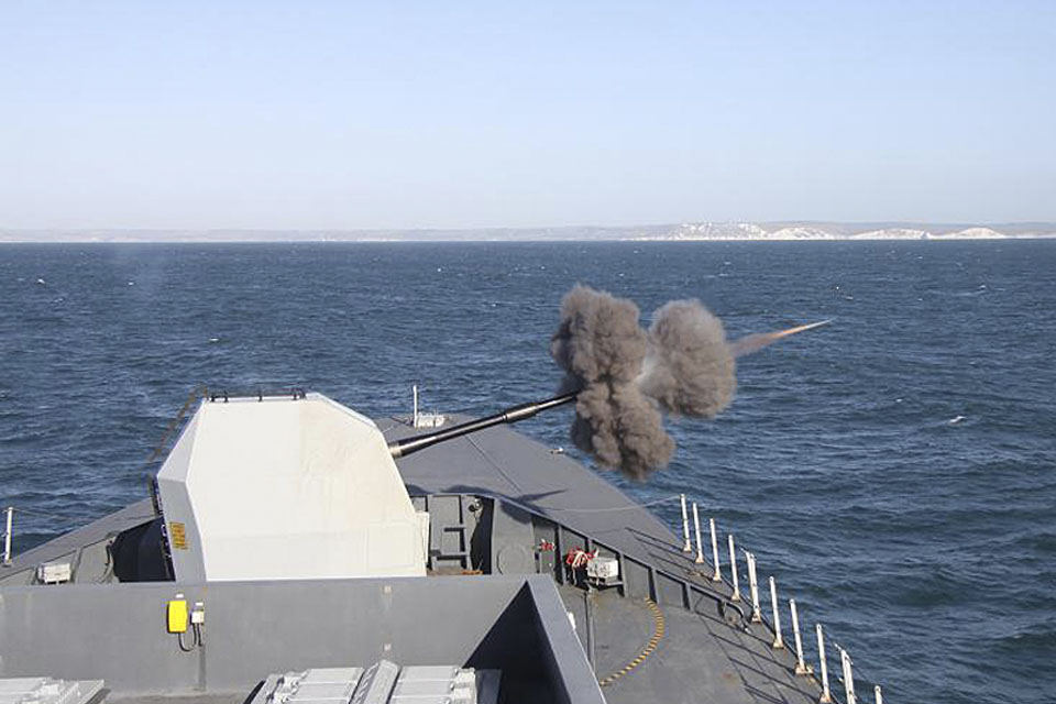 HMS Daring fires her 4.5-inch (114mm) gun during Operational Sea Training 