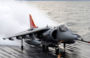 A Harrier GR9, tail repainted and emblazoned with the emblem of 800 Naval Air Squadron, prepares to take-off from the deck of HMS Ark Royal for the last time