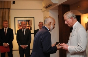 Mr Ismail receives his award from HRH The Prince of Wales.