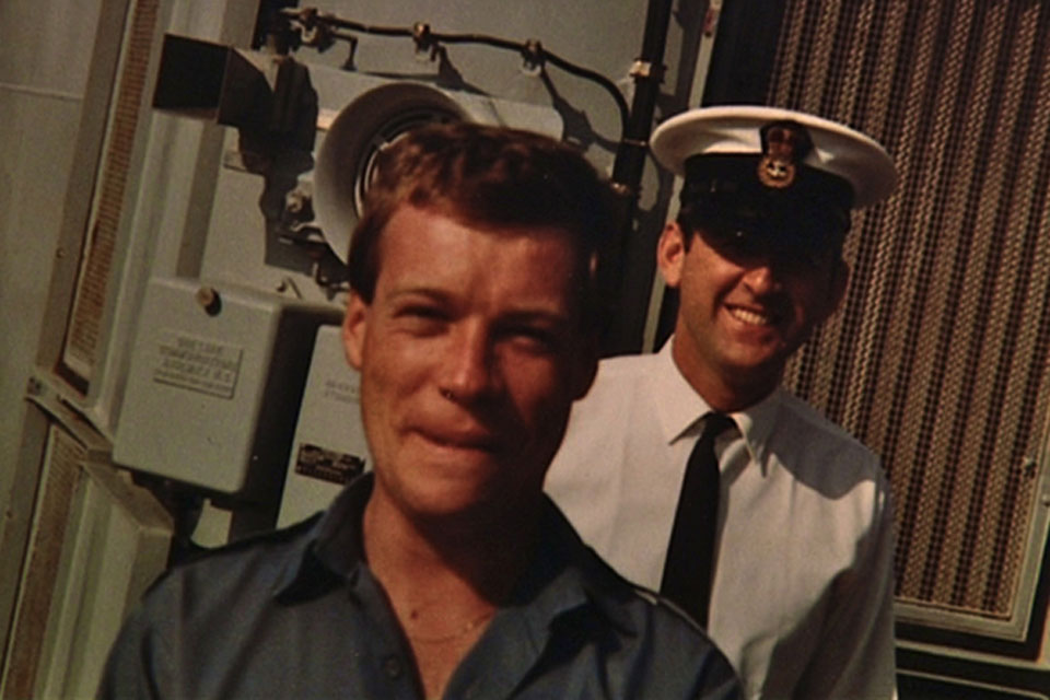 Able Seaman Neil Wilkinson (in front of shot) on board Intrepid in 1982, aged 22