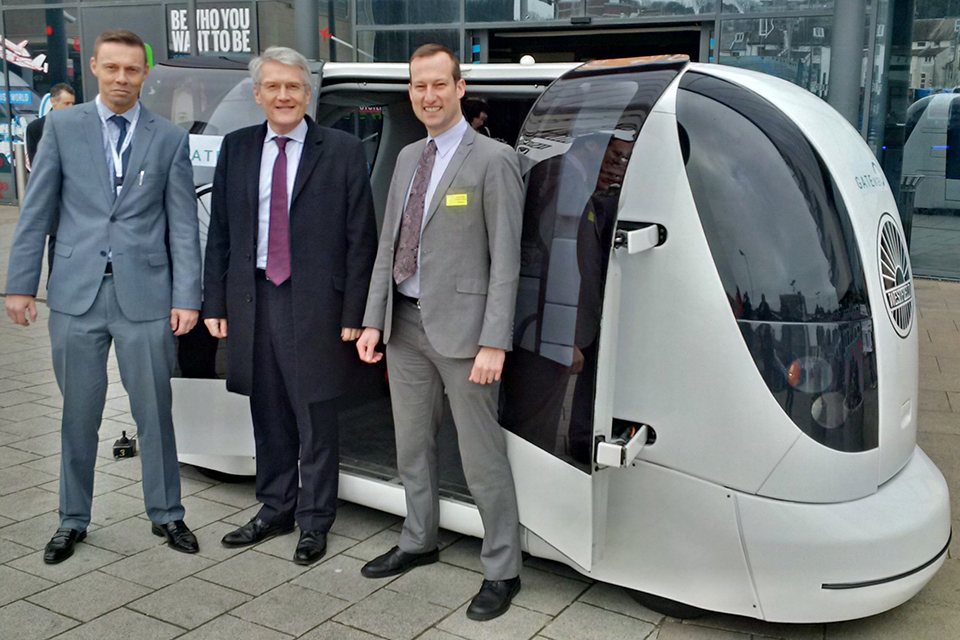 Transport Minister Andrew Jones and a driverless car.