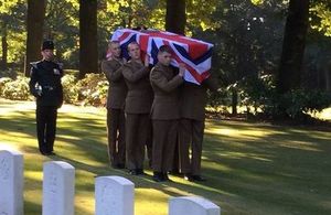 The bugler walks solemnly behind the bearer party. Crown Copyright, All rights reserved