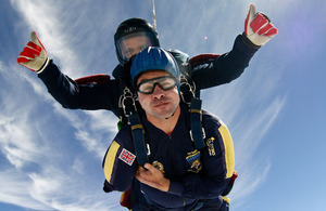 Corporal Andy Reid in a tandem skydive at the Army Parachute Association drop zone at Netheravon in Wiltshire
