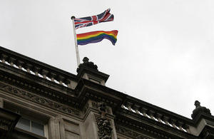 Union Flag and rainbow flag flying over the Cabinet Office building, 70 Whitehall.