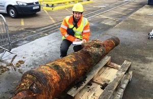 Paolo Croce, Marine Archaeologist, Wessex Archaeology with the recovered cannon at North Quay, Portsmouth International Port. Photo: Gerrit Jan Van Den Bosch/Boskalis Westminster. All rights reserved.