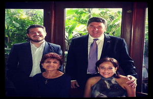 Ambassador Chris Campbell and Chevening scholar Juan Barrios with his grandmother and mother