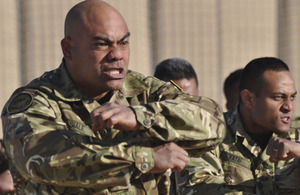A contingent from the Tonga Defence Services issue a traditional challenge, called a Sipi Tau, to their replacements during a ceremonial handover in Camp Bastion, Afghanistan