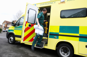 A paramedic getting in an ambulance