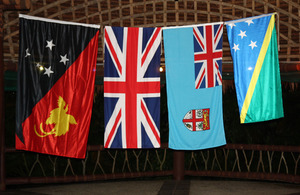 Flags of Papua New Guinea, United Kingdom, Fiji and Solomon Islands.