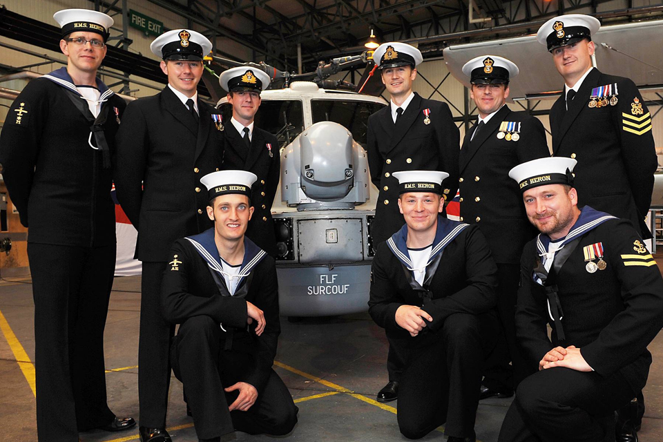 Members of 217 Flight pose in front of their Lynx helicopter