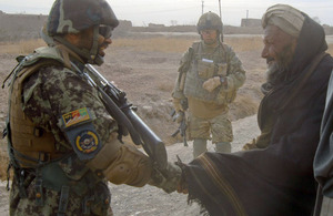 Members of 15 Squadron RAF Regiment and the Afghan Air Force on patrol in the village of Koshab