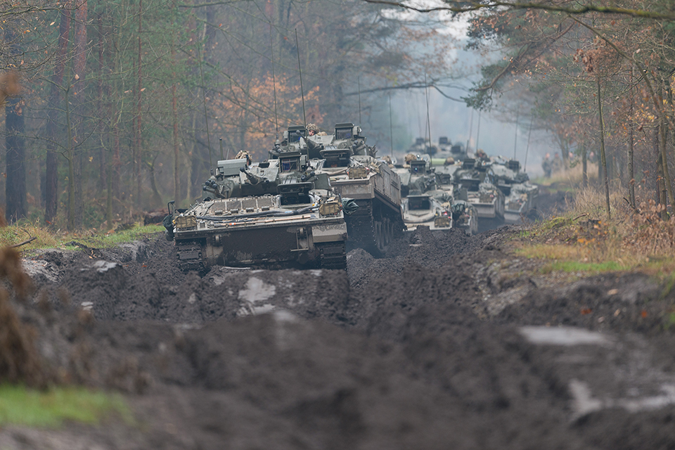 A column of Warrior Armoured fighting vehicles move through an autumnal forest track in Poland [Picture: Staff Sergeant Mark Nesbit RLC Crown copyright]