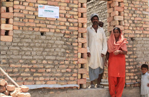 Sabiha Khatoon stands outside her soon-to-be completed new home in Mehar Channa village, in Pakistan's Sindh province. Picture: Vicki Francis/DFID