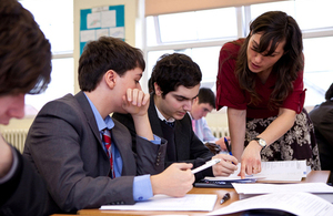 teacher working with students